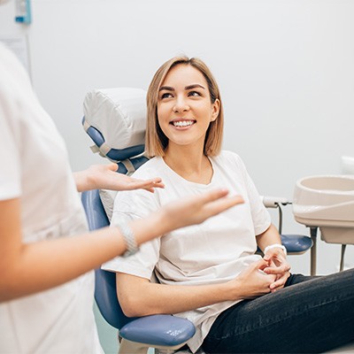 McKinney dentist explaining TMJ treatment options to patient