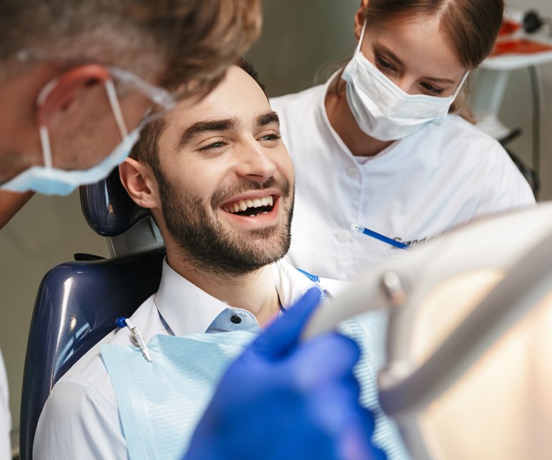 A handsome man getting ready for dental care