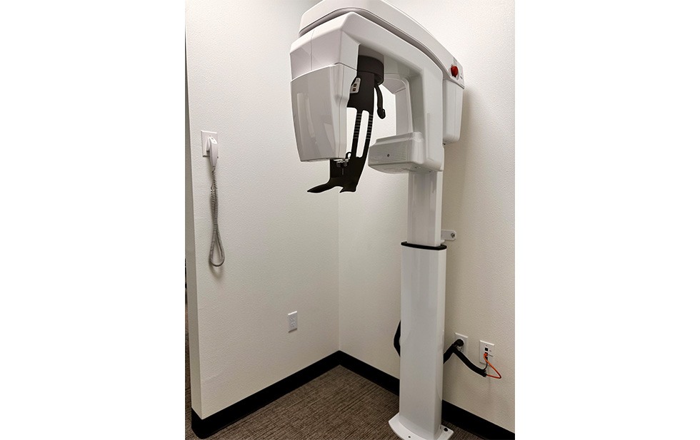 Dentist and patient in dental exam room