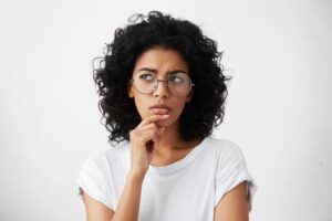 Woman wondering about the bumps on her gums